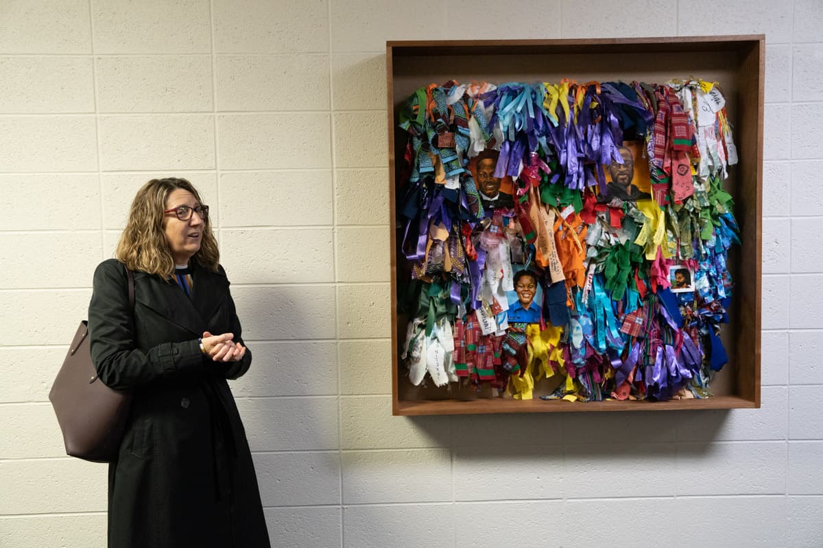 Jocelyn Boryczka in front of Healing Wall panel 5