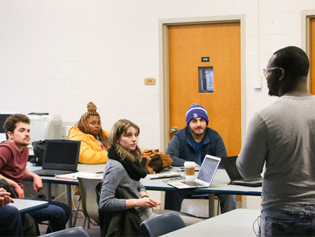 Students listening to a presenter in Single Camera Video Production class