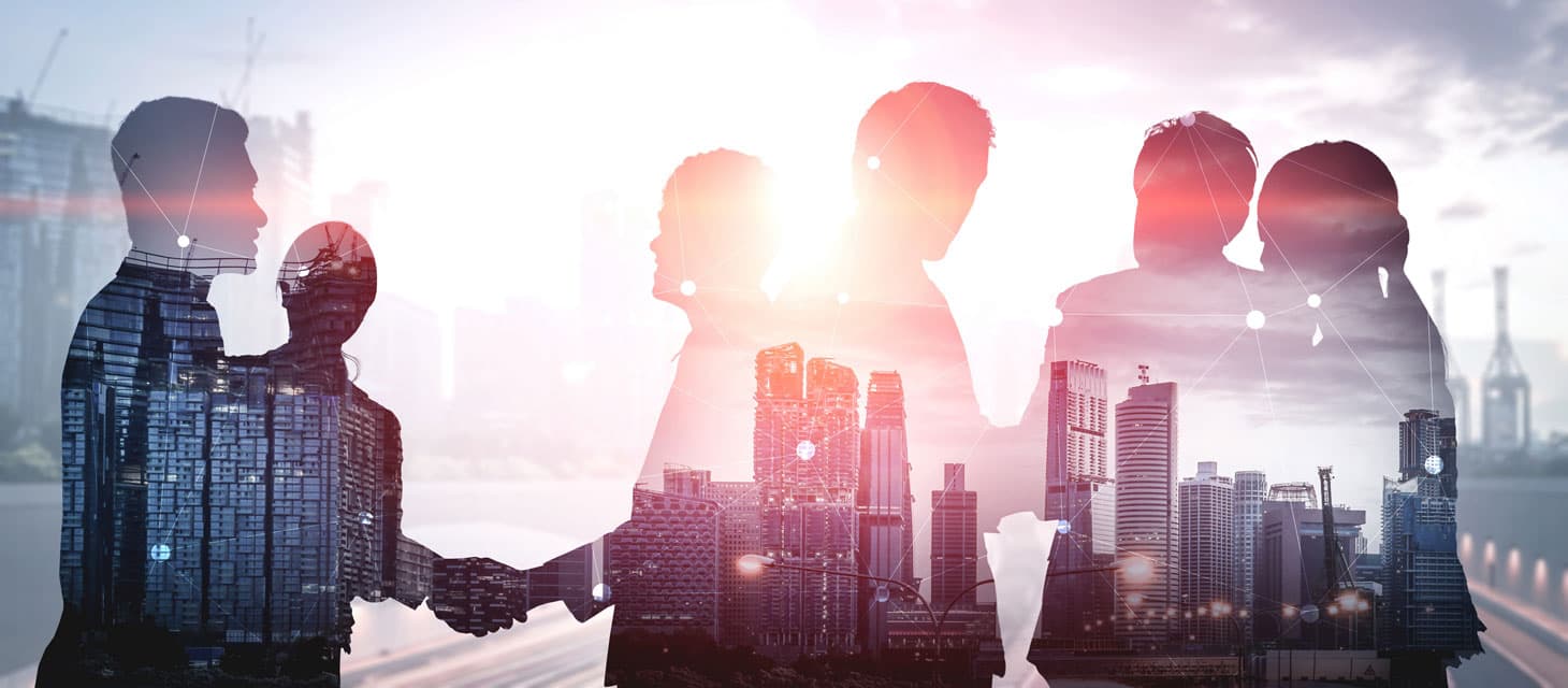 Decorative image showing business people silhouette with cityscape reflection